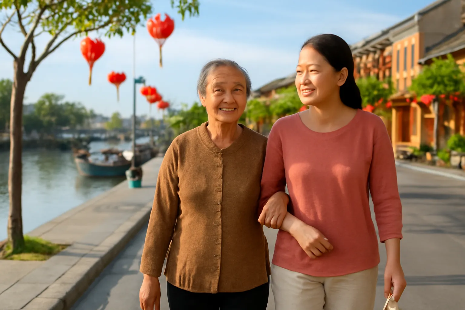 Người mẹ cao tuổi và con gái đi dạo buổi sáng trên đường ven sông Hội An